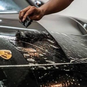 Applying paint protection film (PPF) on a Porsche to protect the paint from scratches and impacts