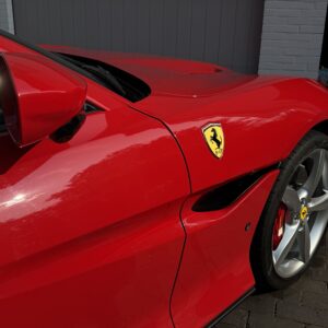 Ferrari red paint after professional luxury car detailing and paint enhancement by ATO GROUP