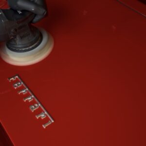 Machine polishing Ferrari paint to restore deep gloss and remove micro scratches